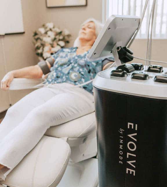 A Woman taking treatment by Empower RF By INMODE | New U Women's Clinic & Aesthetics
