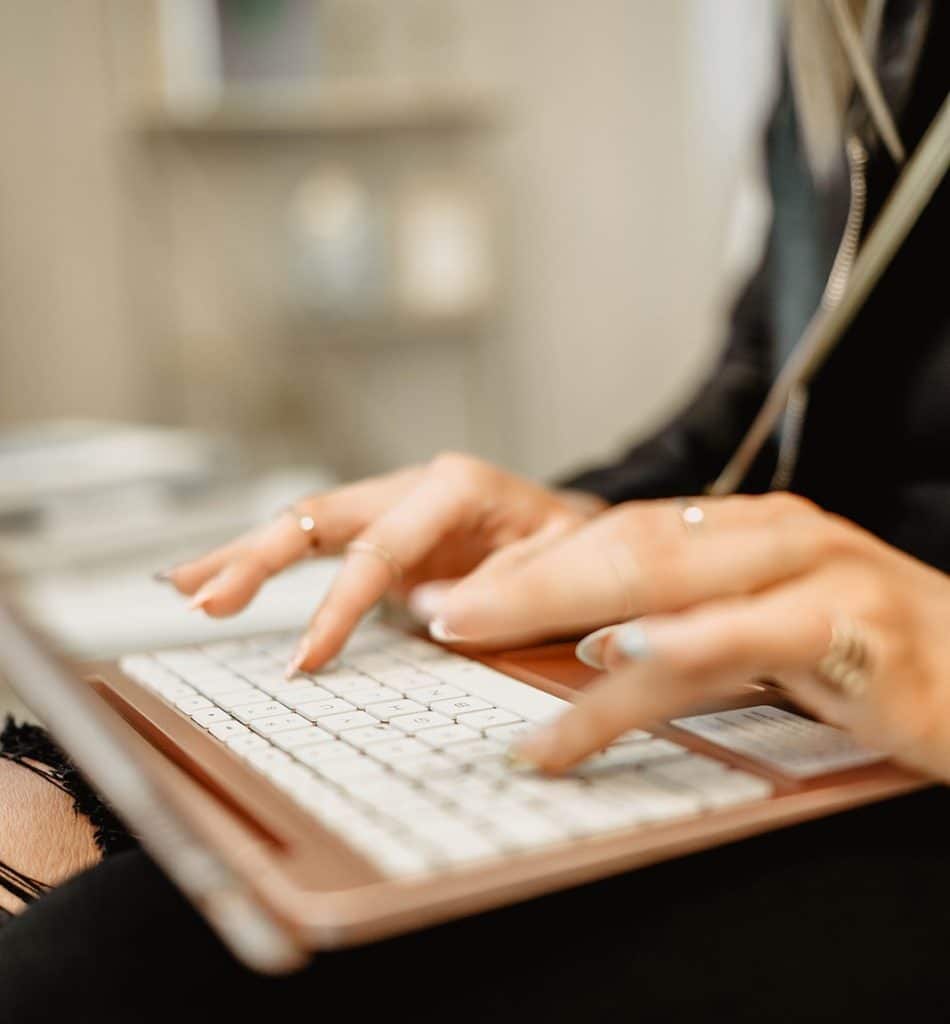 Woman Typing on Keyboard | New U Women's Clinic & Aesthetics in Kennewick, WA